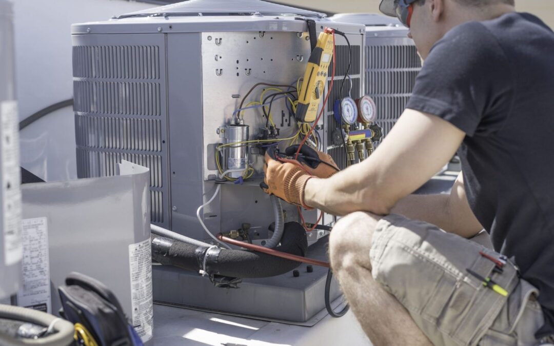 When should I contact a professional for an inspection or repair of my heating and air conditioning system?